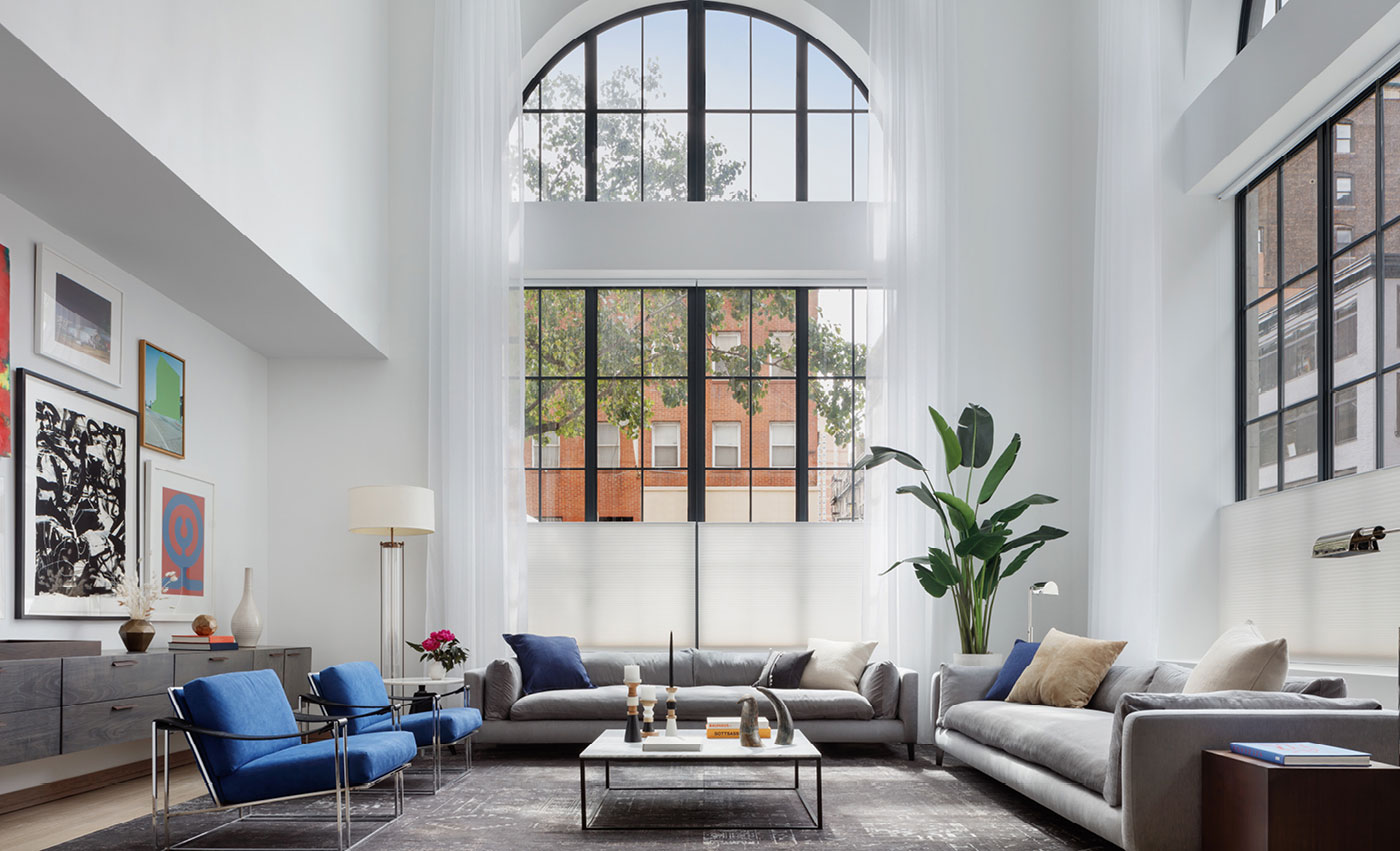 Furnished Maisonette corner living room with 20-foot arched windows